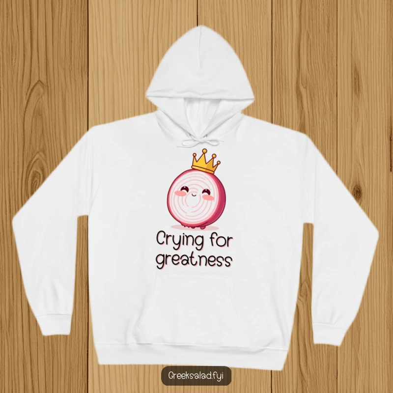 Funny hoodie depicting a blushing red onion slice wearing a small crown, swaying with regal charm and cozy warmth.