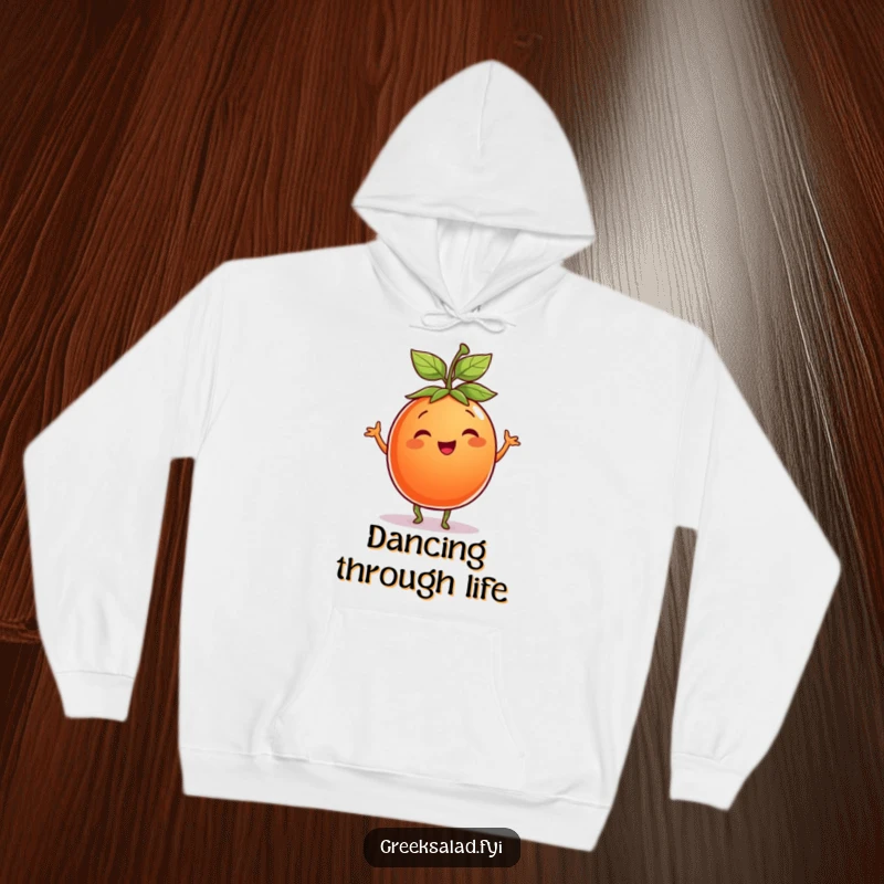 Funny Tomato Hoodie: A smiling tomato wearing a leaf hat dances with infectious joy, offering cozy warmth.
